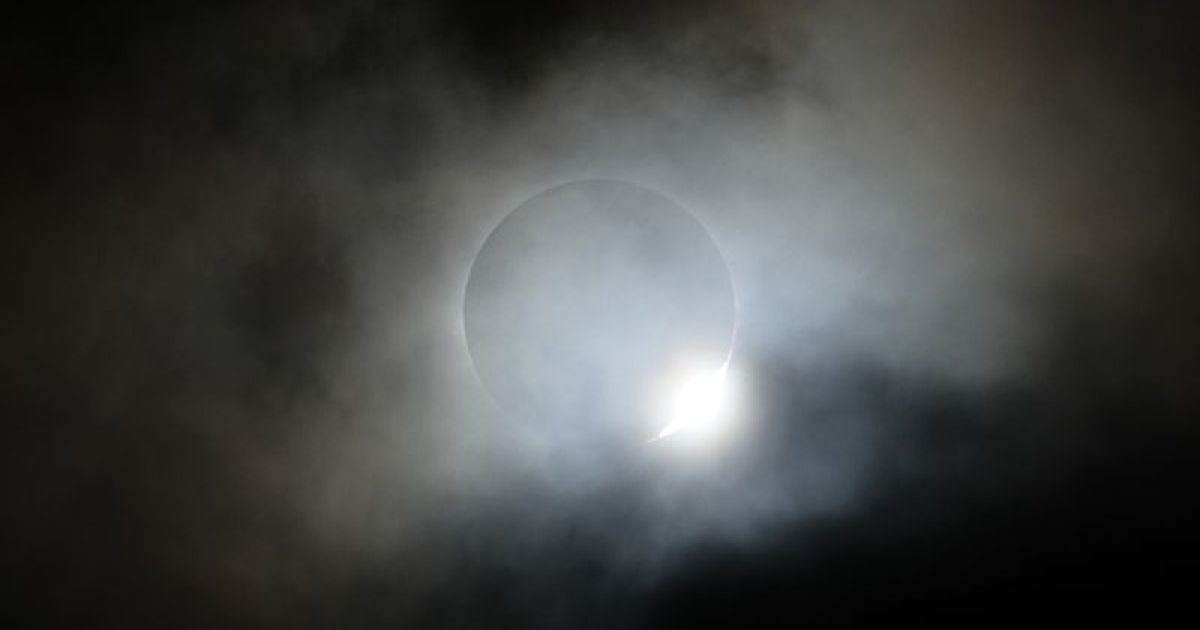 Prufrock: Mysterious Dark Matter, Bacteria Balloons and the Solar Eclipse, Glen Campbell and Charles Portis