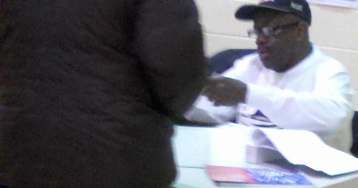 Election Judge Wears Obama Cap While Checking in Voters in Obama's Chicago Ward