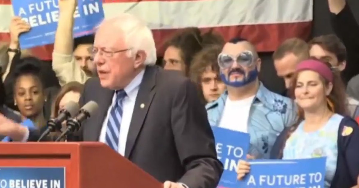 Man With Blue Beard Blows Kisses At Bernie